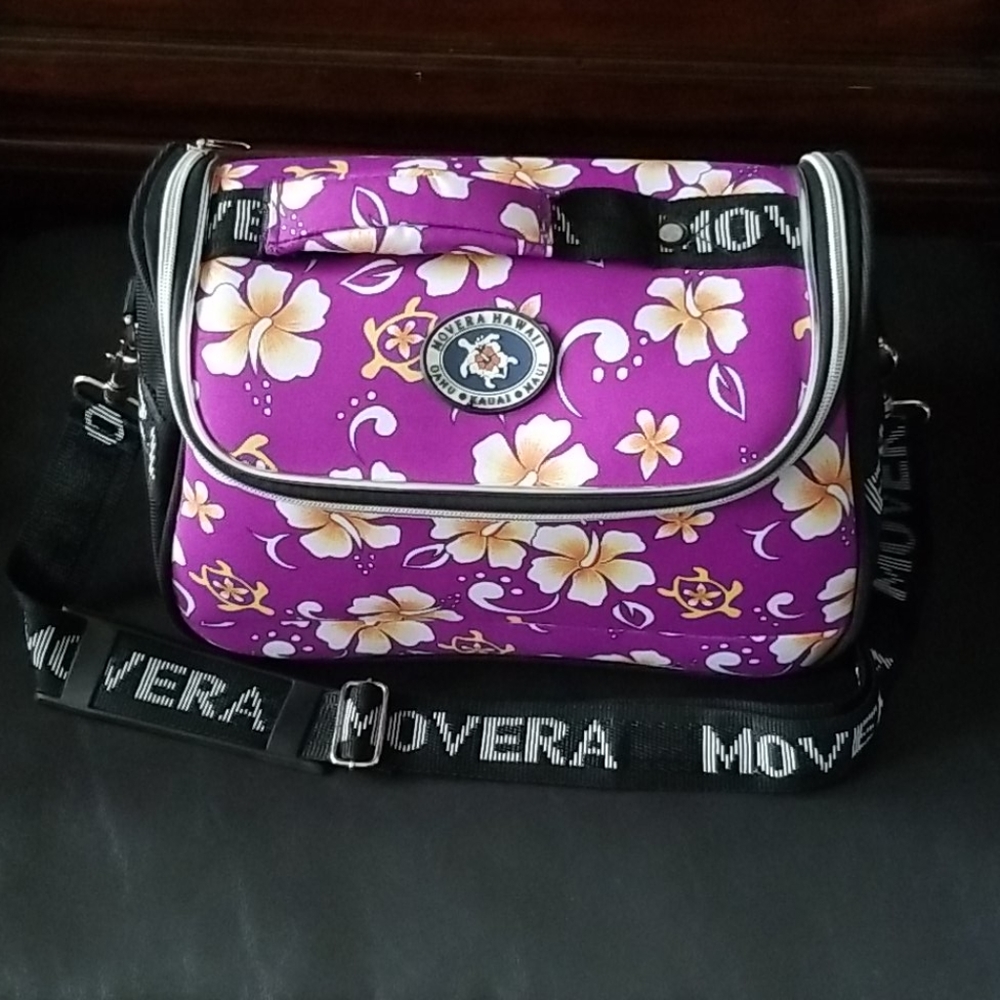 Traveling cosmetic bag with strap